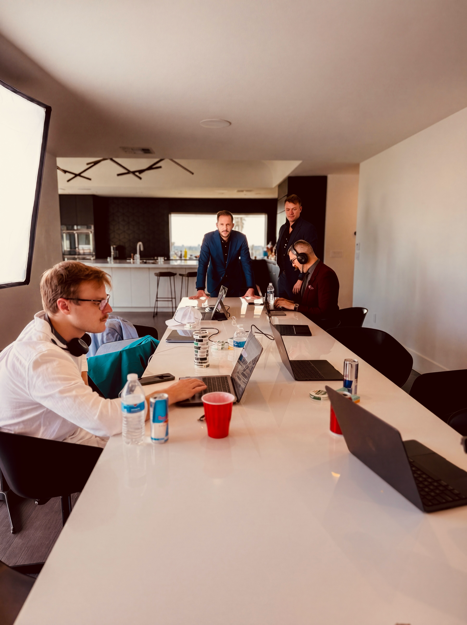 The team heads-down on laptops around the table