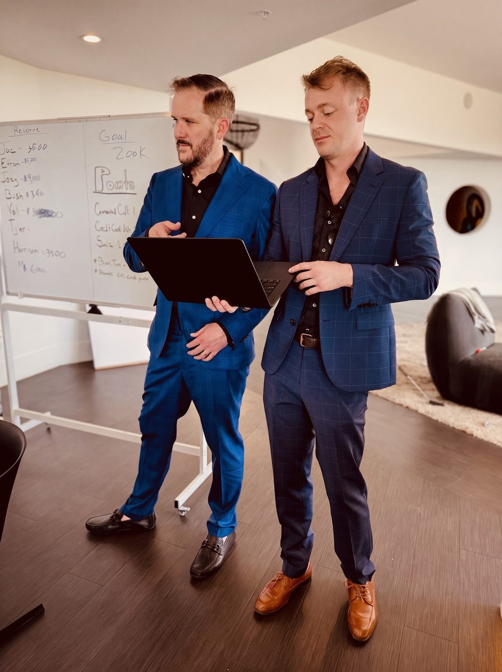 Button Up operators in suits at an offsite